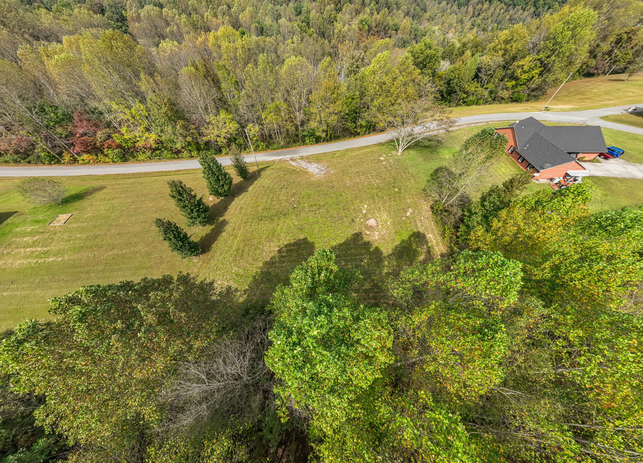 0 Andy Anderson Road Lynchburg, TN 37352 - Photo 9 of 11 a view of a lake with a house in the background