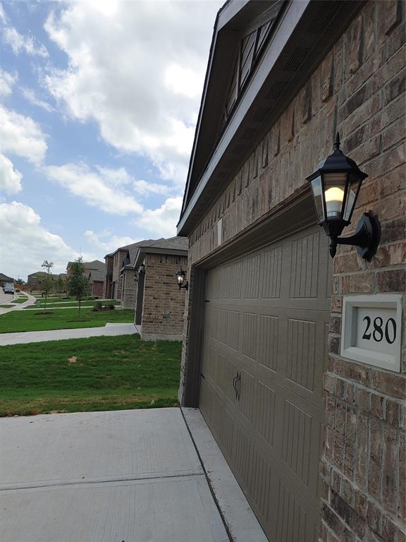 280 Moonstone Way Princeton, TX 75407 - Photo 17 of 17 Garage with a yard