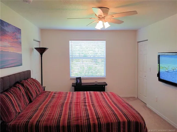a bedroom with a bed and a closet