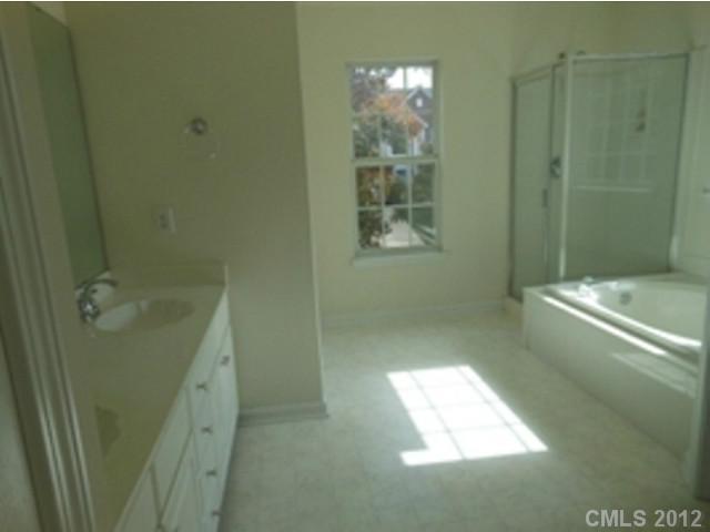 16023 Hollingbourne Road Huntersville, NC 28078 - Photo 11 of 12 a bathroom with a bathtub