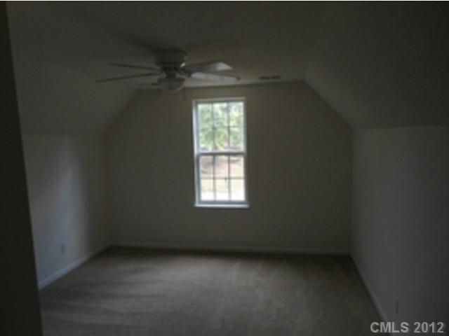 16023 Hollingbourne Road Huntersville, NC 28078 - Photo 12 of 12 an empty room with a window