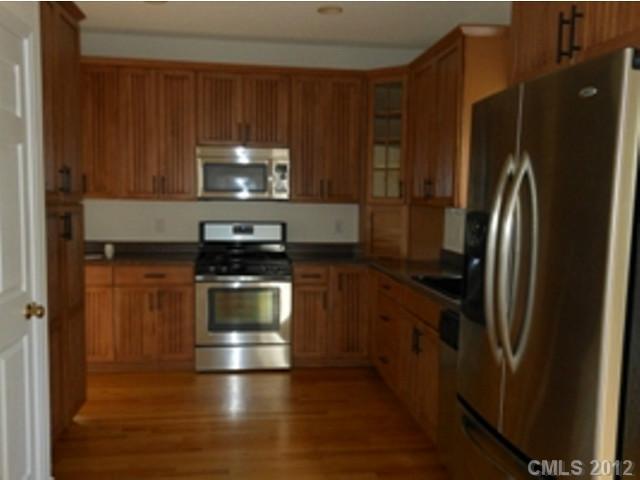 16023 Hollingbourne Road Huntersville, NC 28078 - Photo 5 of 12 a kitchen with a refrigerator stove and microwave