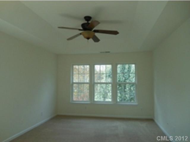 16023 Hollingbourne Road Huntersville, NC 28078 - Photo 10 of 12 an empty room with a window