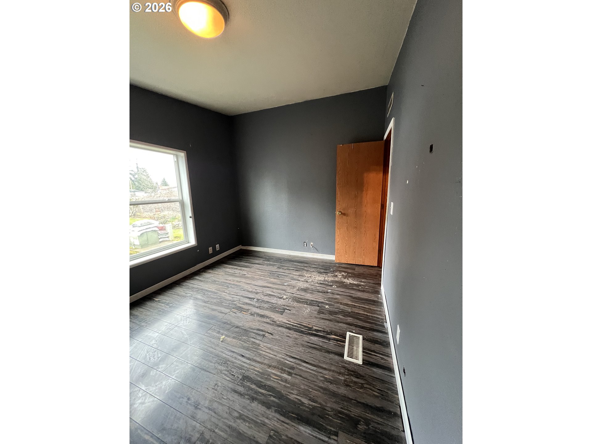 5200 Southeast 132nd Avenue, Unit 14 Portland, OR 97236 - Photo 14 of 17 a view of an empty room and window