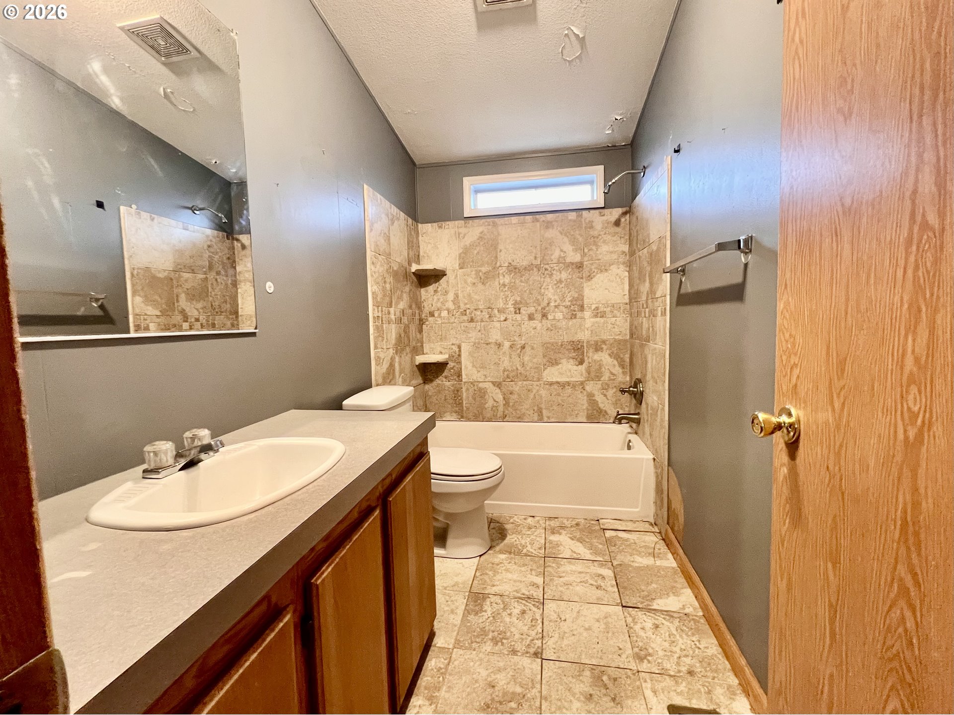 5200 Southeast 132nd Avenue, Unit 14 Portland, OR 97236 - Photo 15 of 17 a bathroom with a sink a toilet and shower