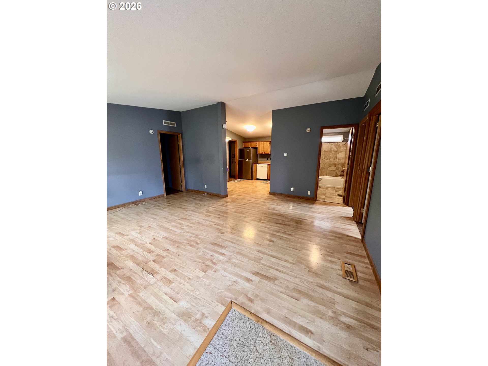 5200 Southeast 132nd Avenue, Unit 14 Portland, OR 97236 - Photo 3 of 17 a view of a hallway with wooden floor