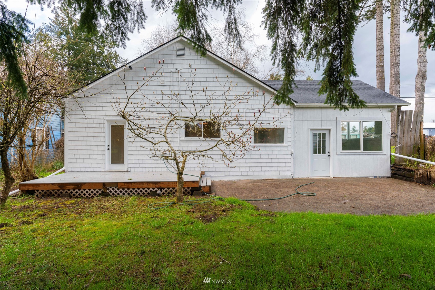 413 West 4th Avenue Pe Ell, WA 98572 - Photo 29 of 32 a white house that has tree in front of it