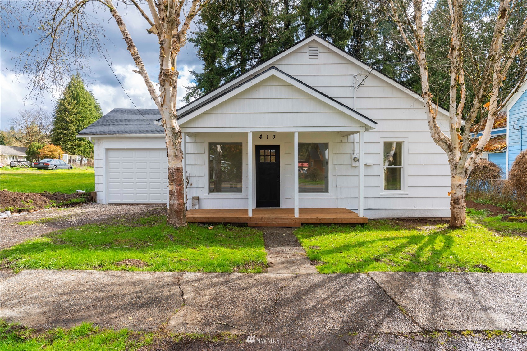 413 West 4th Avenue Pe Ell, WA 98572 - Photo 32 of 32 a view of a house with a yard and a large tree