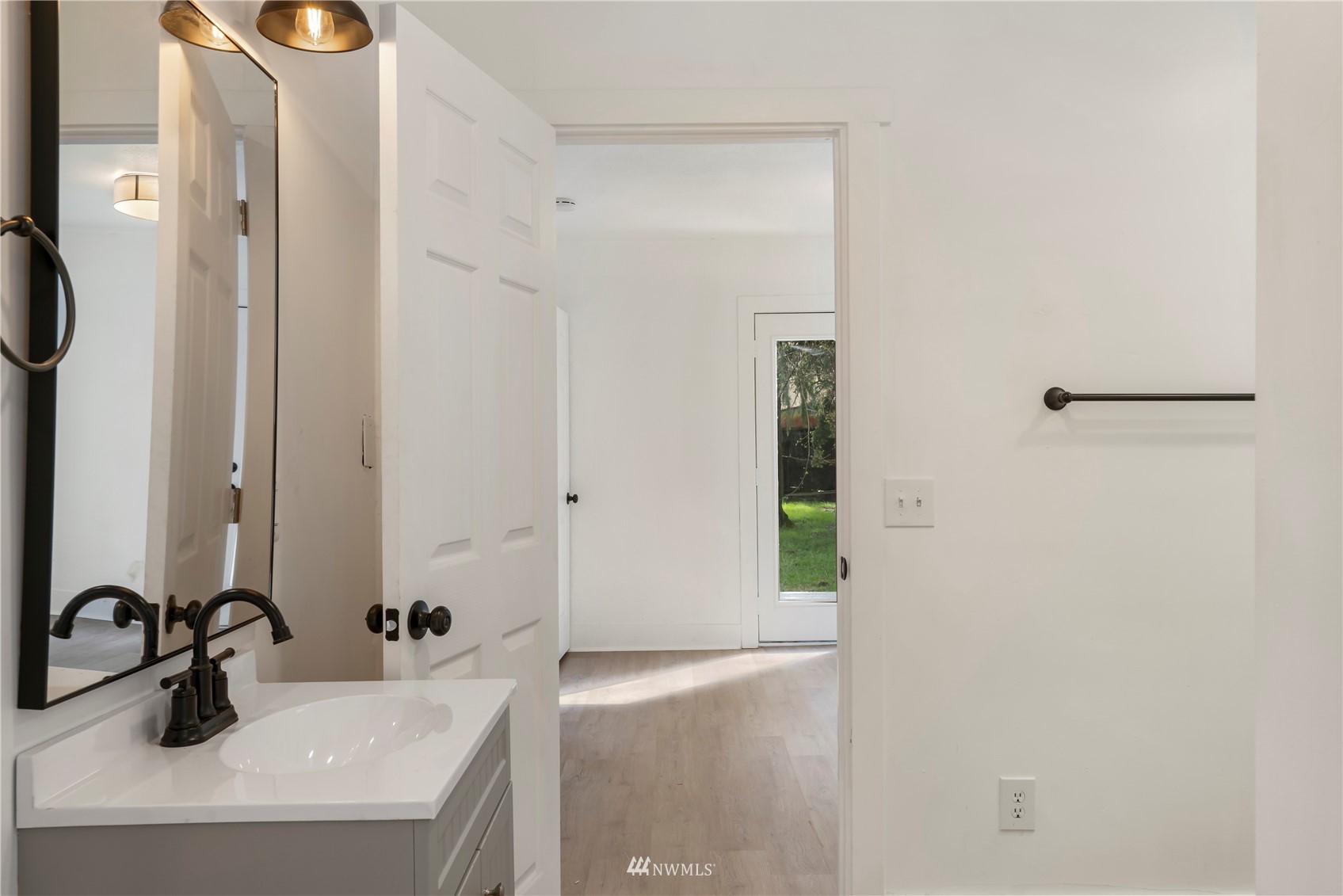 413 West 4th Avenue Pe Ell, WA 98572 - Photo 9 of 32 a bathroom with a sink and a mirror