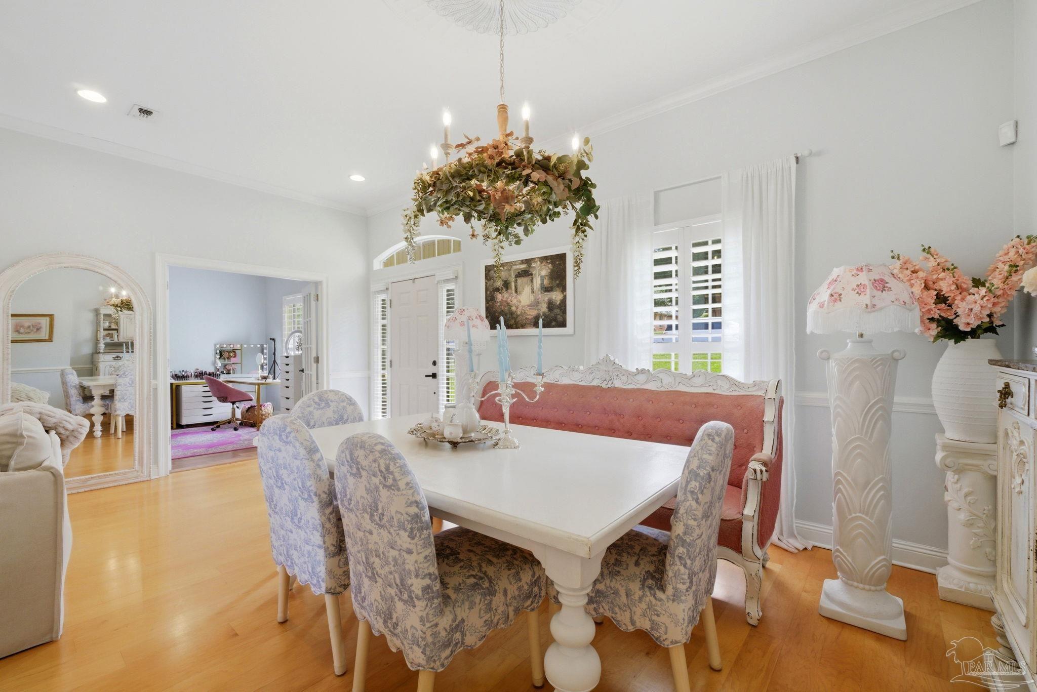 5931 Otter Point Road Pensacola, FL 32504 - Photo 9 of 67 a view of a dining room with furniture and wooden floor