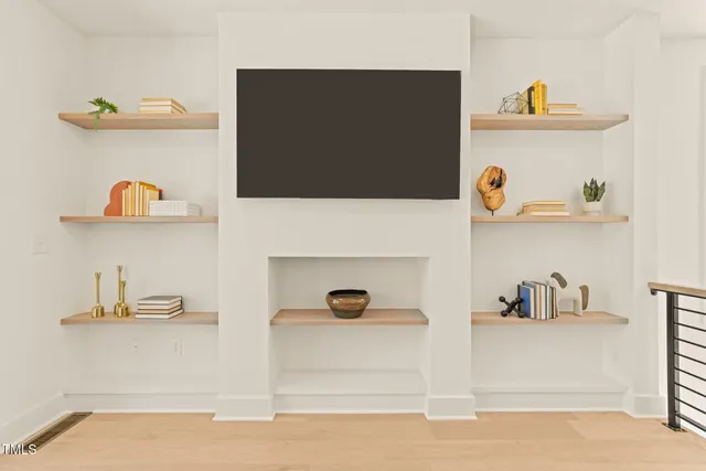a living room with shelf