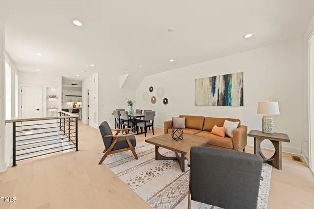 a living room with furniture and a table