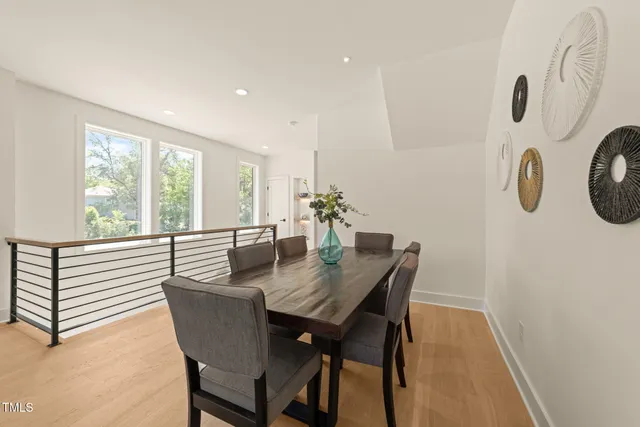a view of a dining room with furniture window and outside view