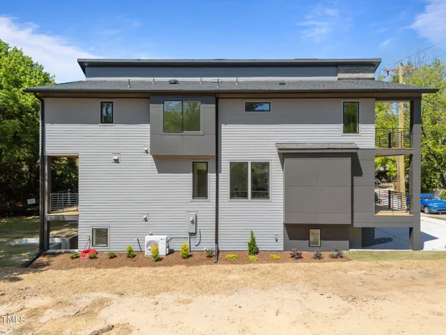 a view of a bedroom with furniture and window