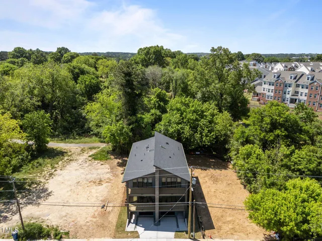 a bathroom with a sink mirror and a toilet