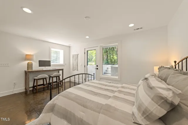 a hallway with table and couch