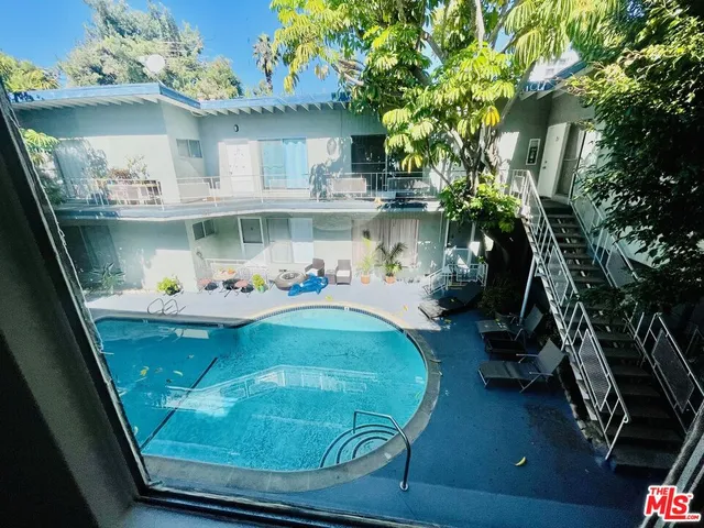a view of a kitchen with a sink and a fireplace