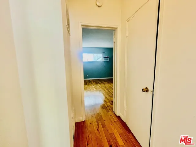 a view of a bathroom from a hallway
