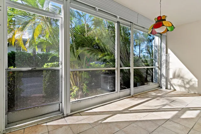a view of a glass door with a floor to ceiling window