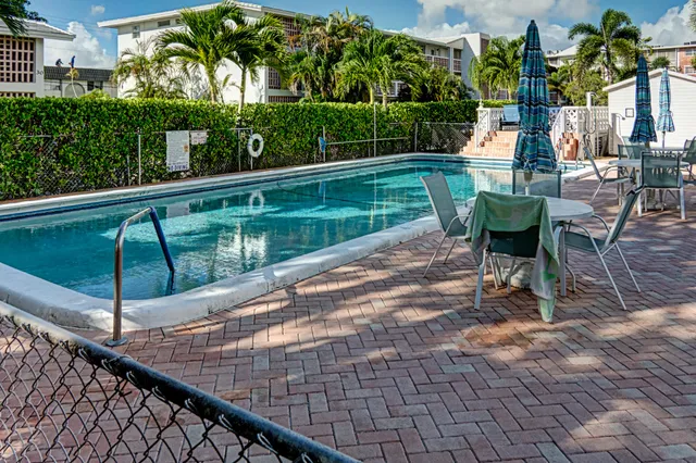 a view of a swimming pool with a patio