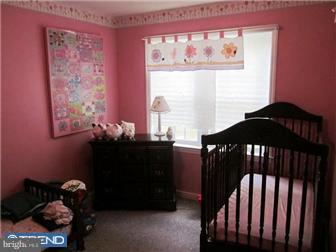8615 Old Line Road Philadelphia, PA 19128 - Photo 11 of 12 a bedroom with a bed and a window
