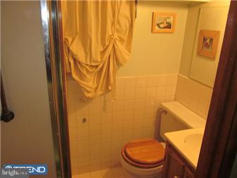 8615 Old Line Road Philadelphia, PA 19128 - Photo 4 of 12 a white toilet sitting next to a sink
