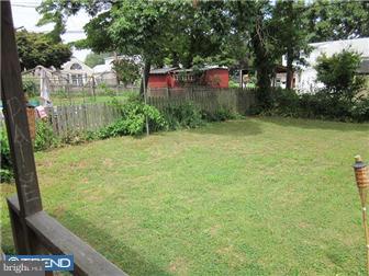 8615 Old Line Road Philadelphia, PA 19128 - Photo 8 of 12 a backyard of a house with lots of green space and fountain