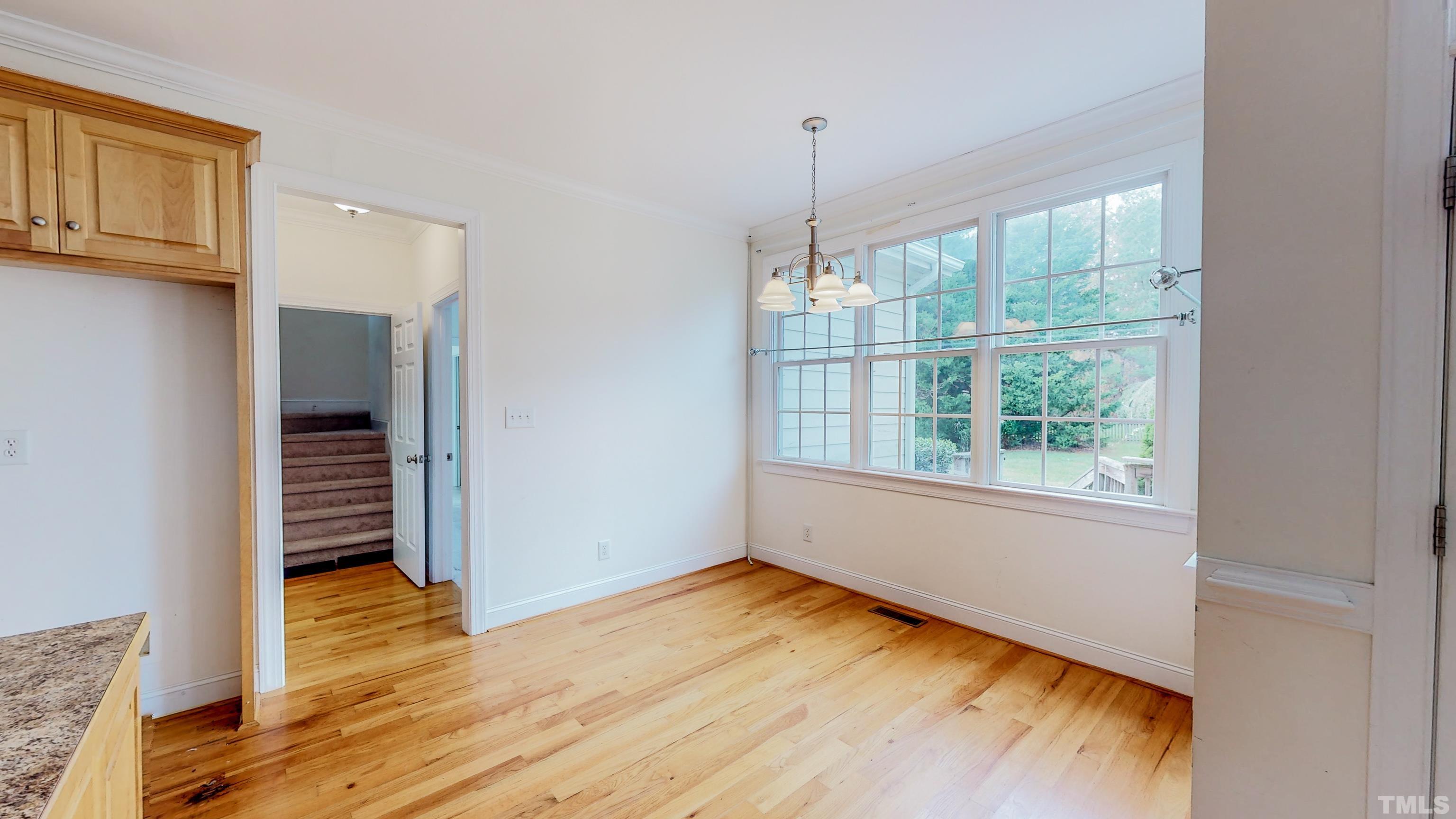 134 Fletcher Ridge Road Timberlake, NC 27583 - Photo 17 of 52 a view of empty room with wooden floor and fan