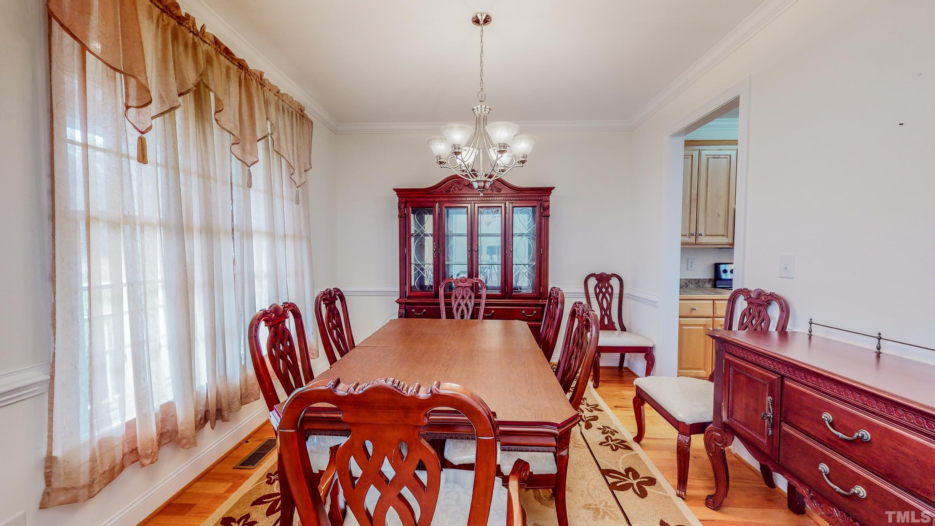 134 Fletcher Ridge Road Timberlake, NC 27583 - Photo 19 of 52 a view of a dining room with furniture window and outside view