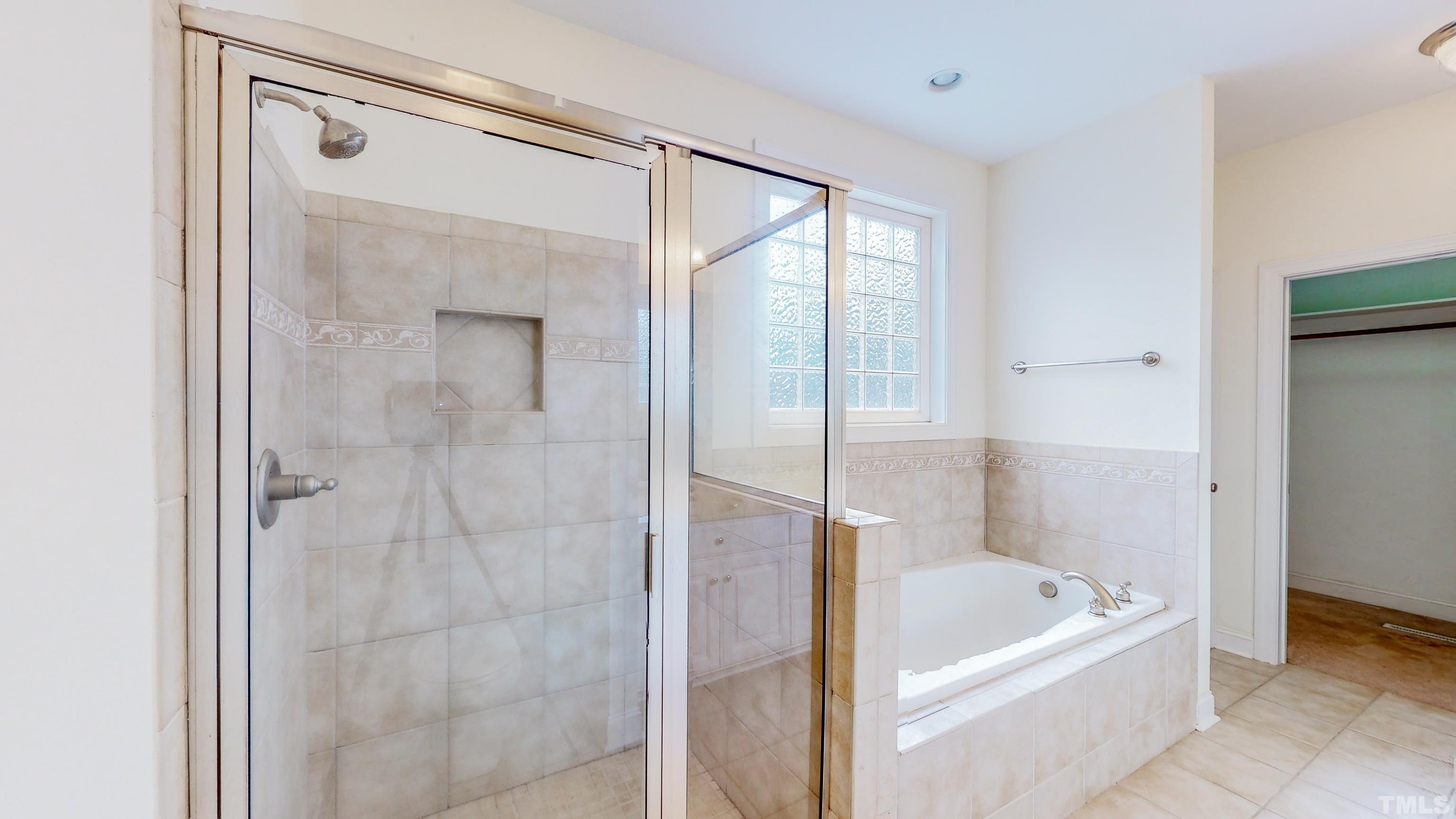 134 Fletcher Ridge Road Timberlake, NC 27583 - Photo 29 of 52 a bathroom with a bathtub and a shower
