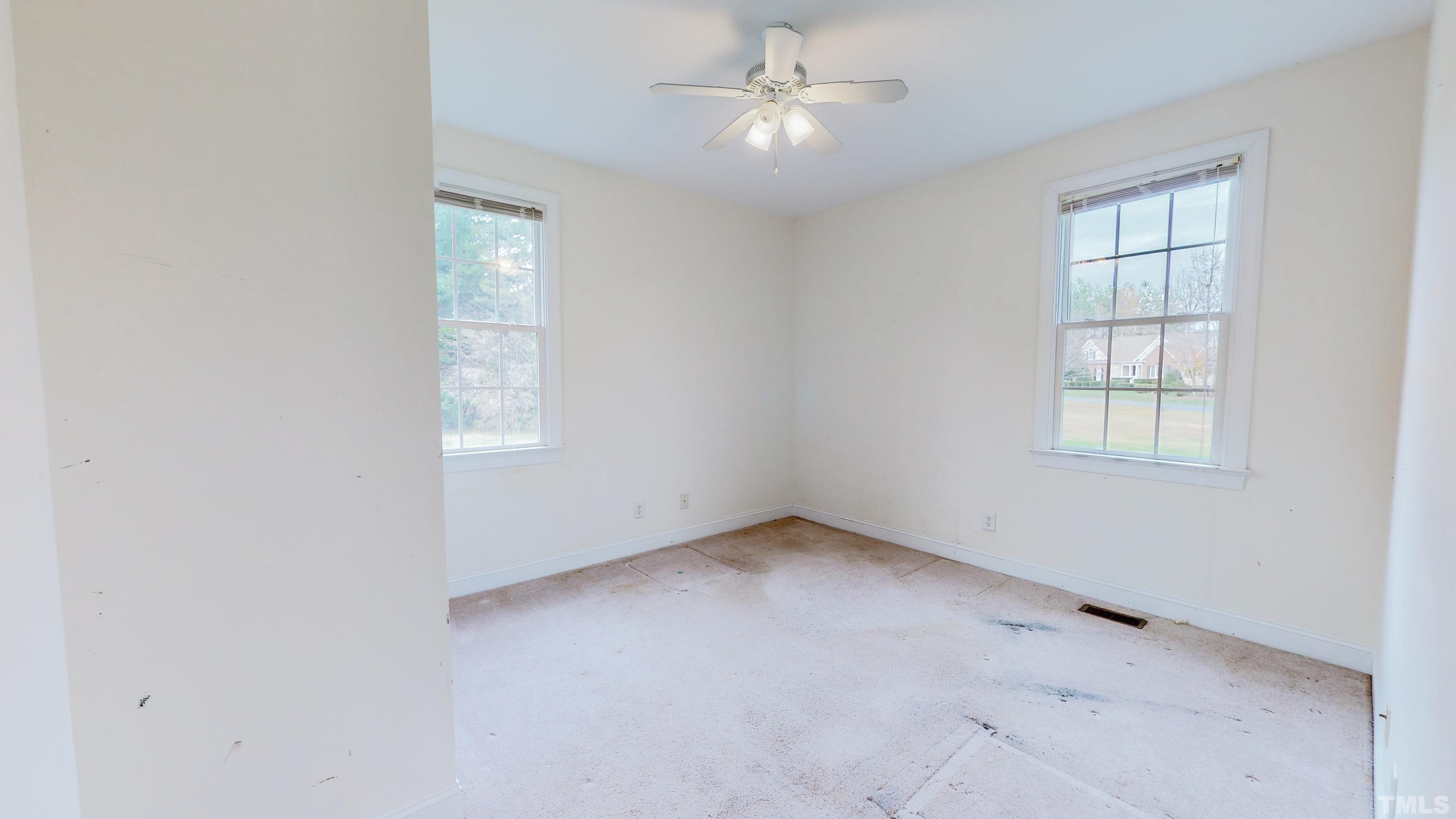 134 Fletcher Ridge Road Timberlake, NC 27583 - Photo 33 of 52 an empty room with a window and ceiling fan