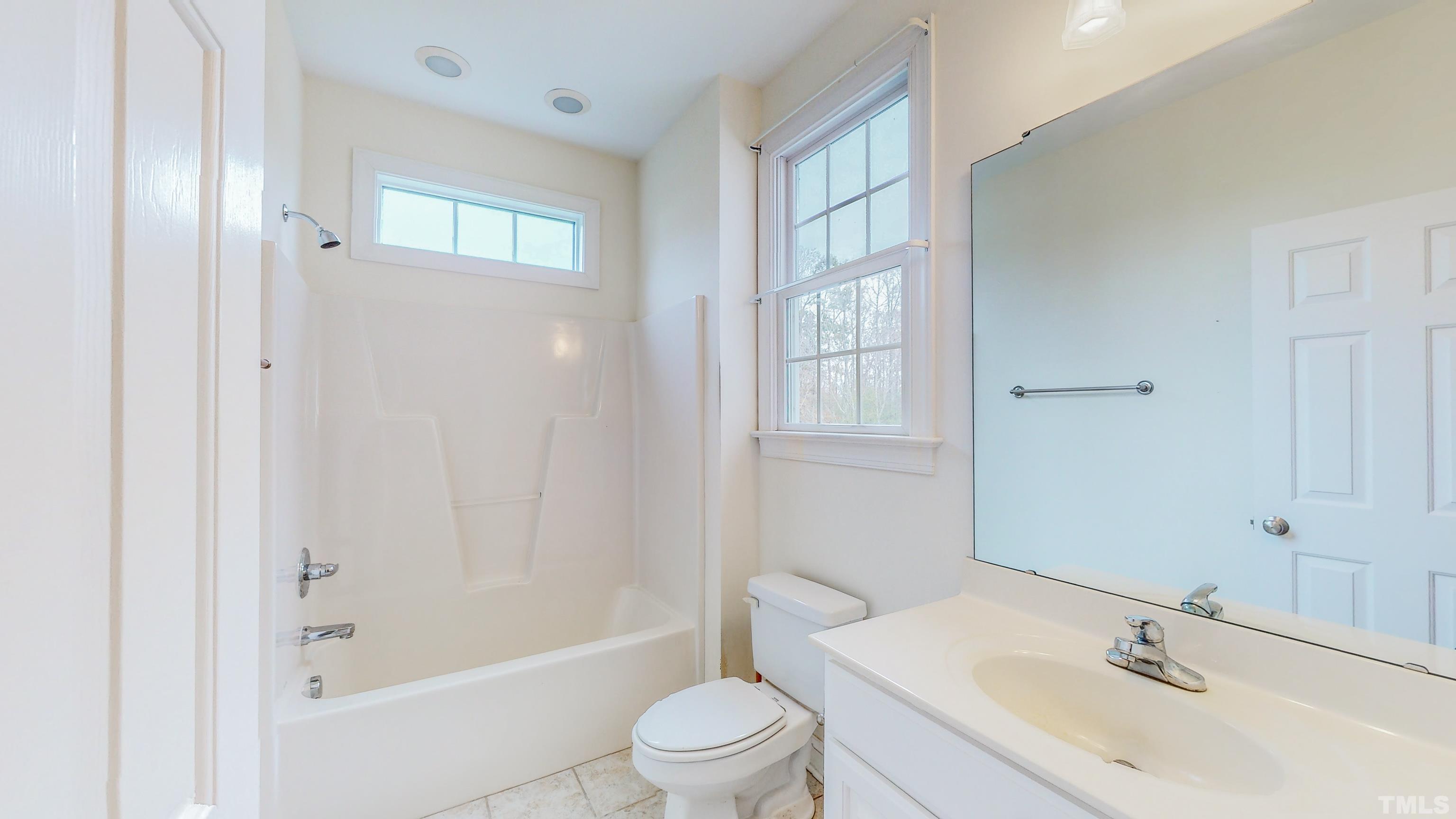 134 Fletcher Ridge Road Timberlake, NC 27583 - Photo 35 of 52 a bathroom with a sink toilet and shower