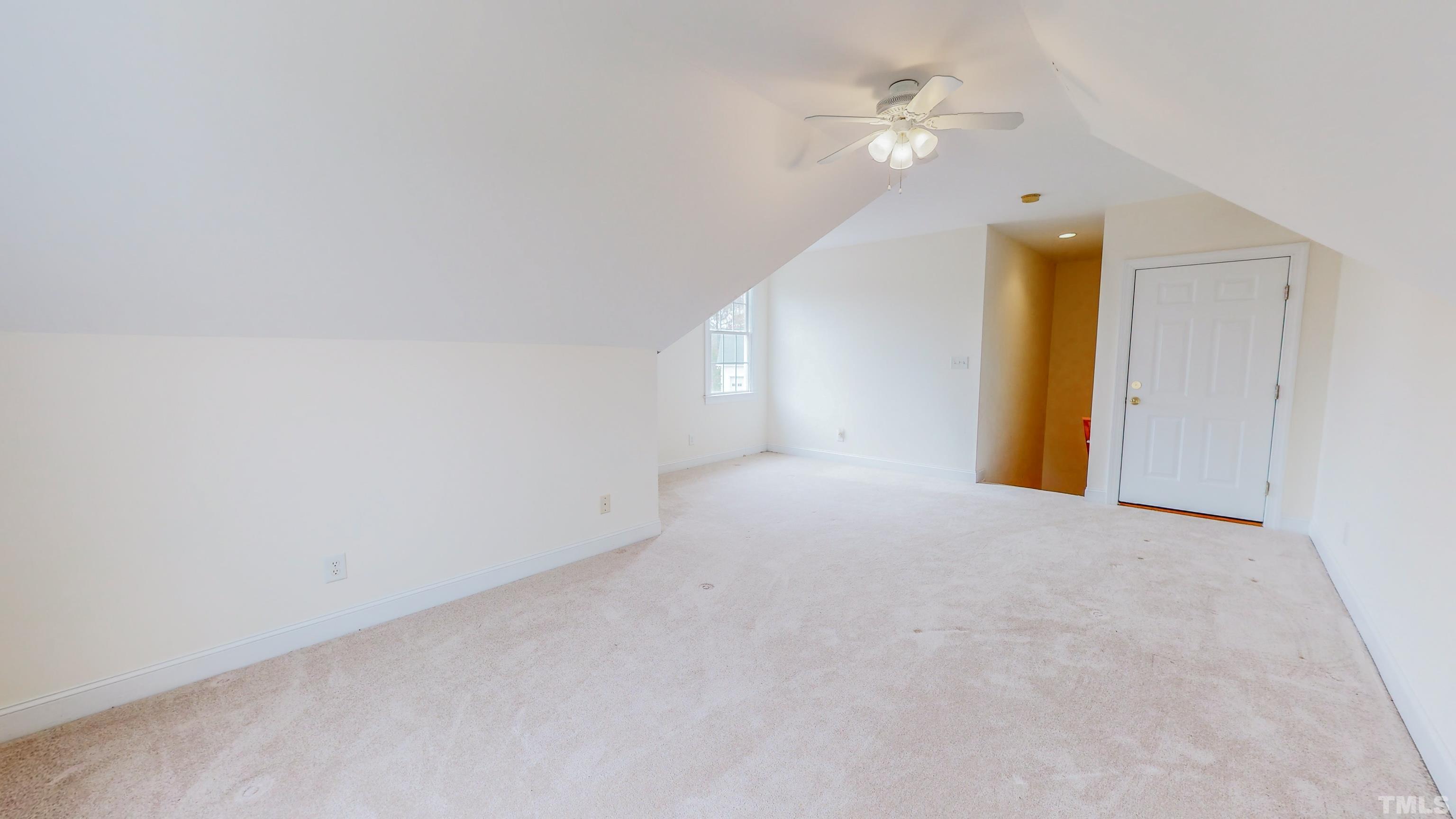 134 Fletcher Ridge Road Timberlake, NC 27583 - Photo 39 of 52 a view of an empty room with a ceiling fan