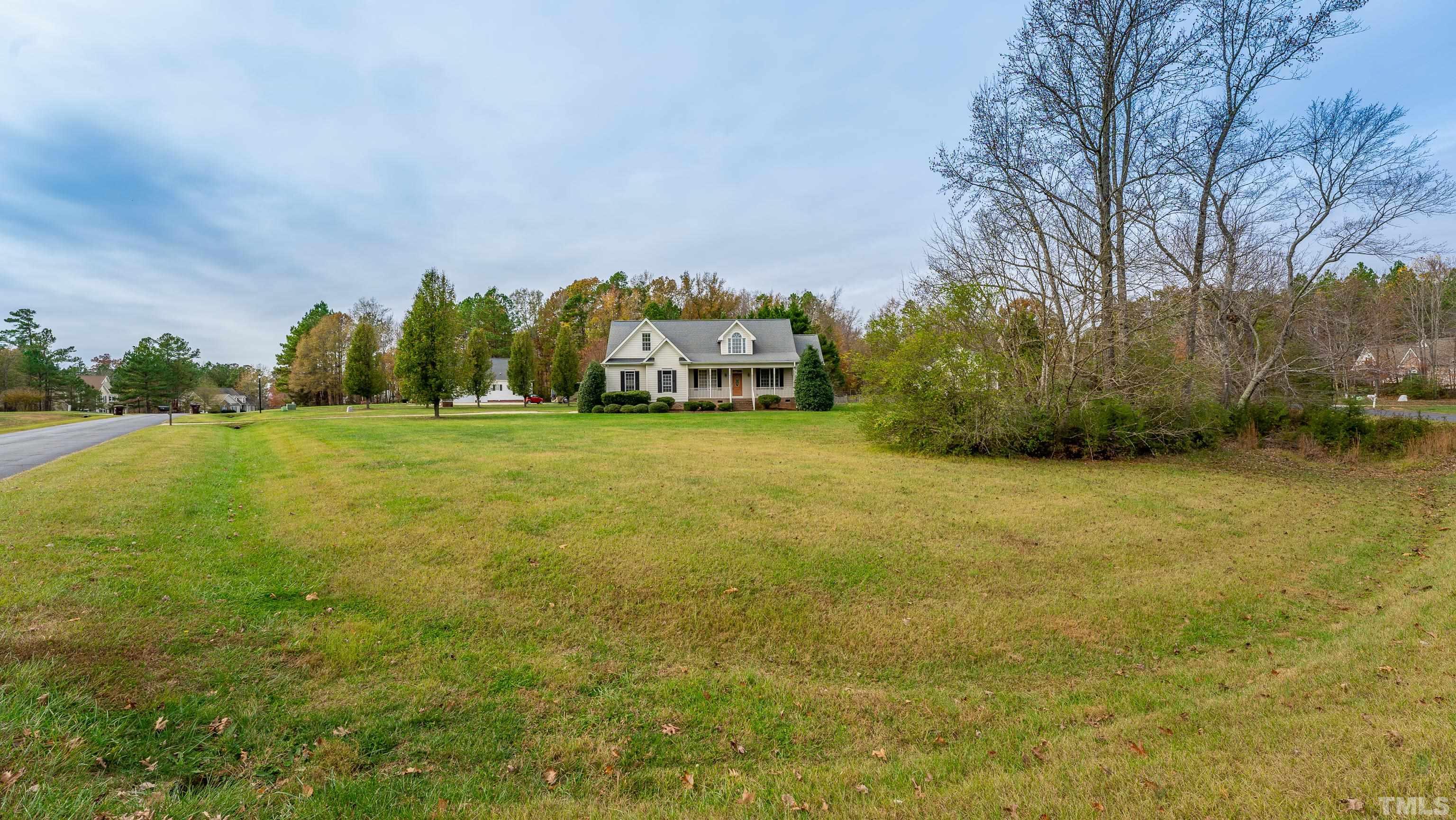 134 Fletcher Ridge Road Timberlake, NC 27583 - Photo 43 of 52 a view of a field with trees in front of it