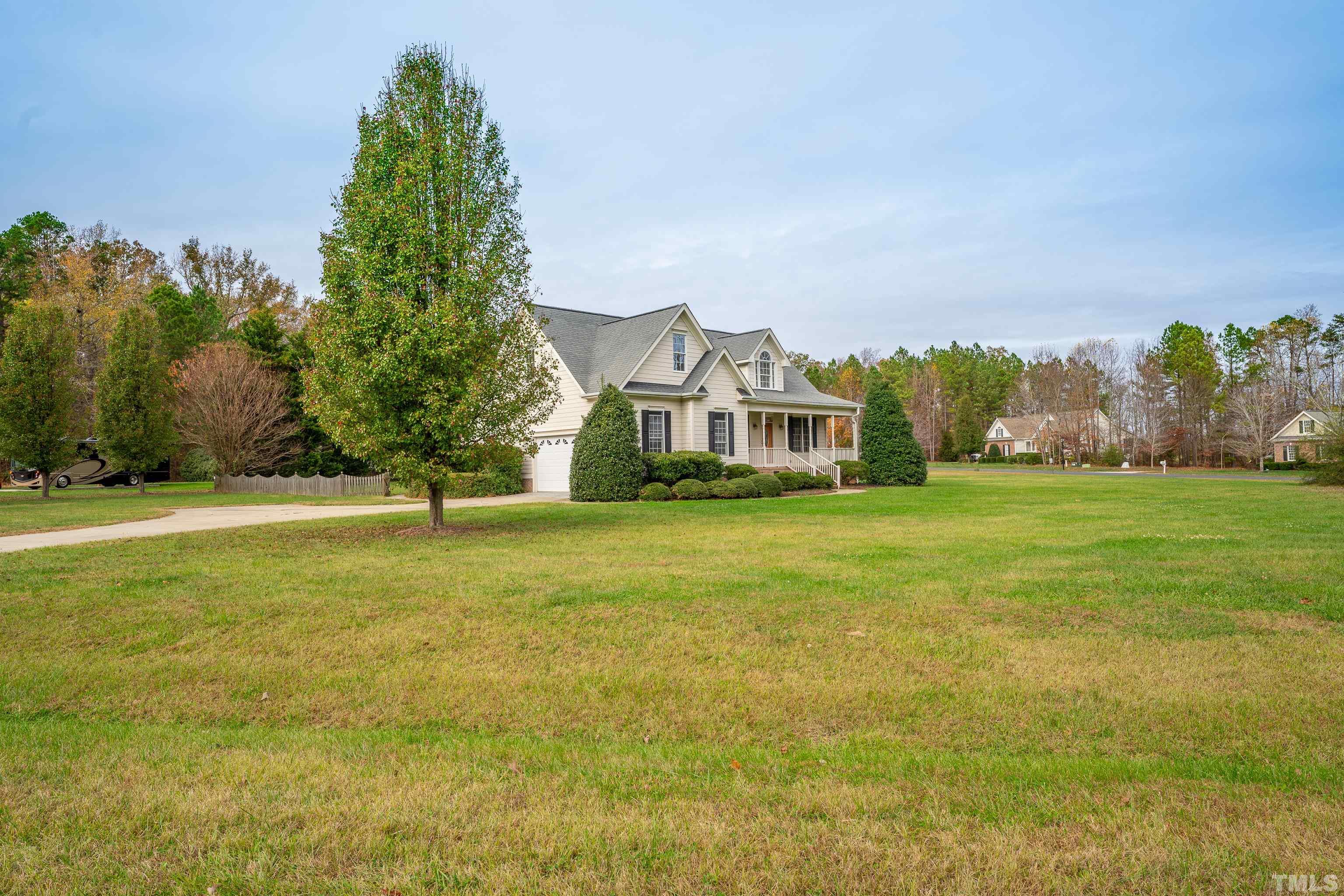 134 Fletcher Ridge Road Timberlake, NC 27583 - Photo 50 of 52 a front view of a house with a yard