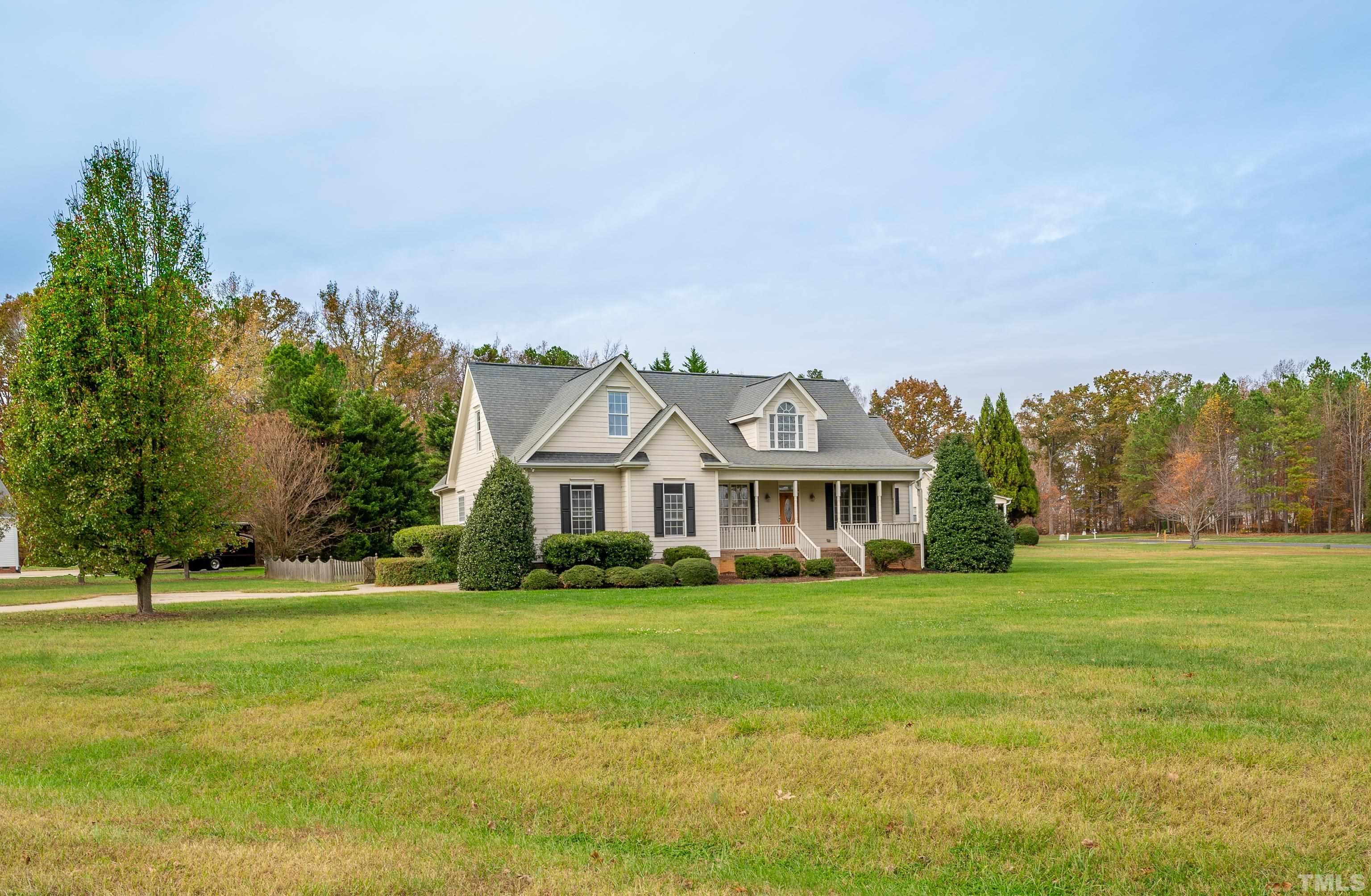134 Fletcher Ridge Road Timberlake, NC 27583 - Photo 7 of 52 a front view of a house with a yard