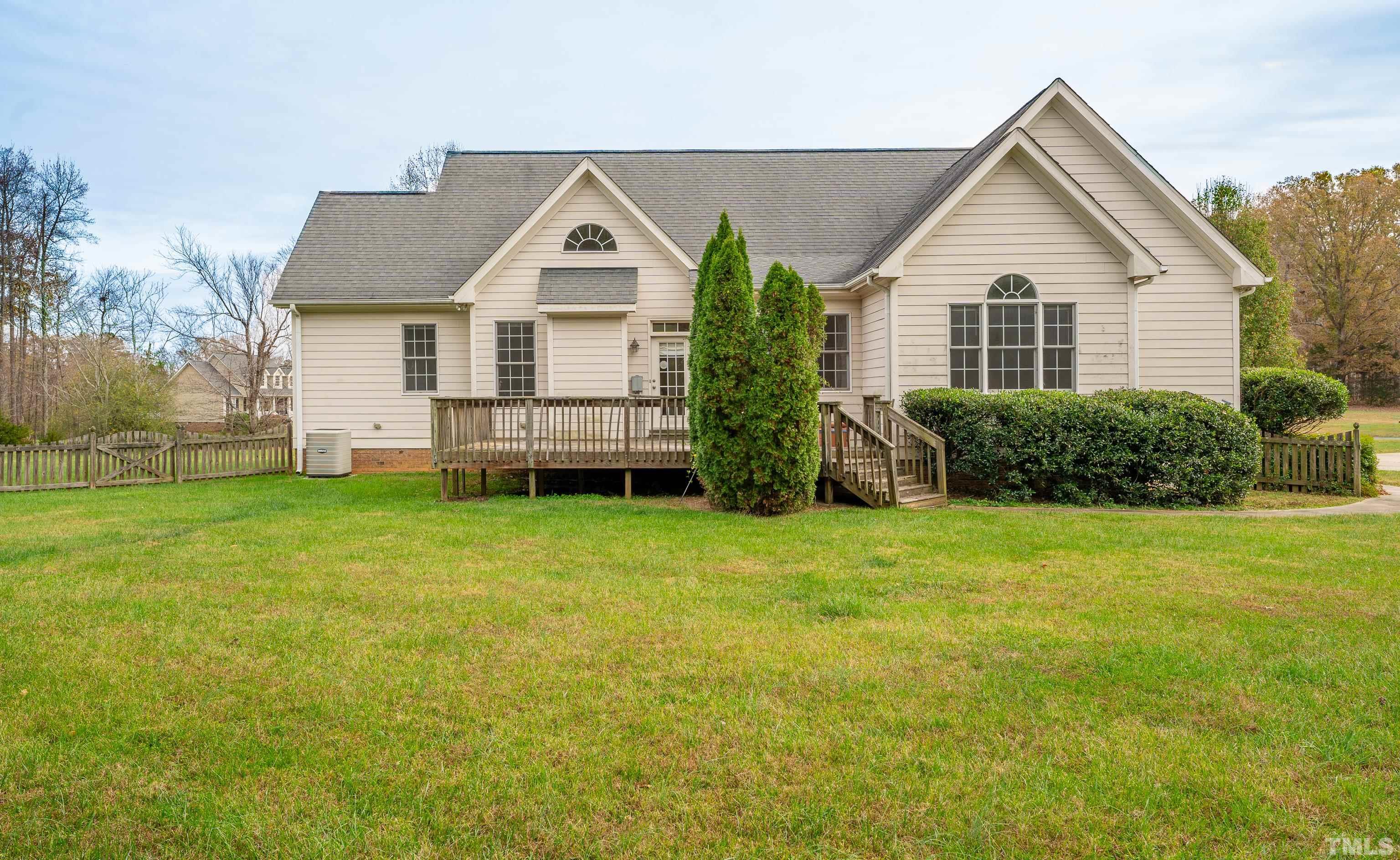 134 Fletcher Ridge Road Timberlake, NC 27583 - Photo 8 of 52 a front view of a house with garden