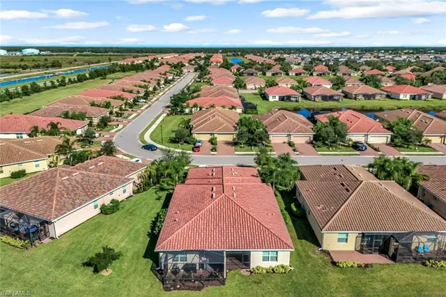 an aerial view of residential houses with outdoor space