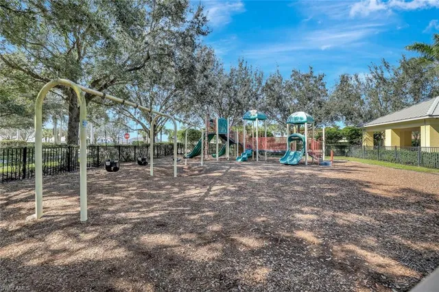 a view of street with tall trees