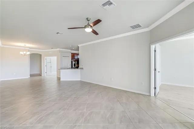 a view of a kitchen with a dishwasher and white cabinets with wooden floor