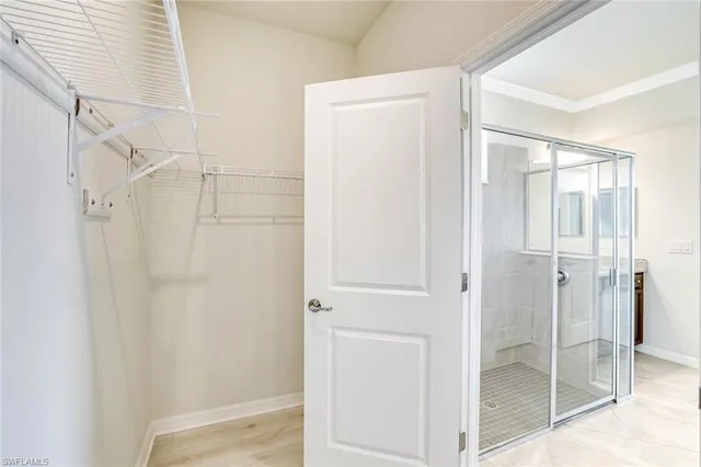 a bathroom with a glass shower door