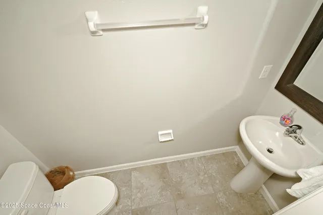 a bathroom with a sink and toilet