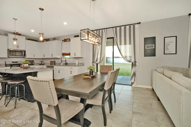 a kitchen with refrigerator cabinets and a sink