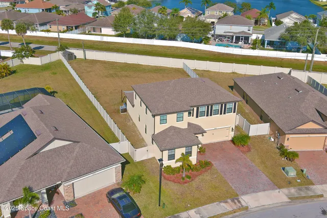 an aerial view of a house with swimming pool