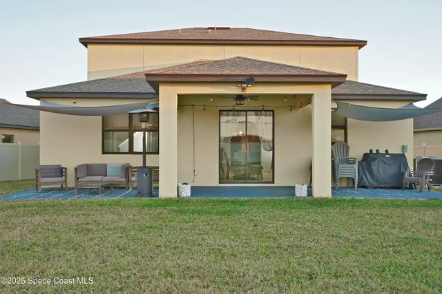 a view of a big house with a yard