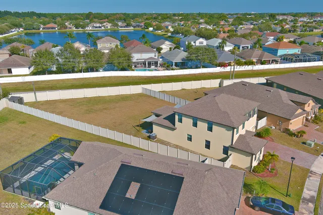 a view of balcony with two large trees and pool