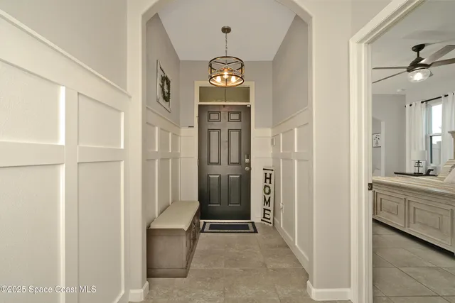 a view of a hallway view with wooden floor and staircase