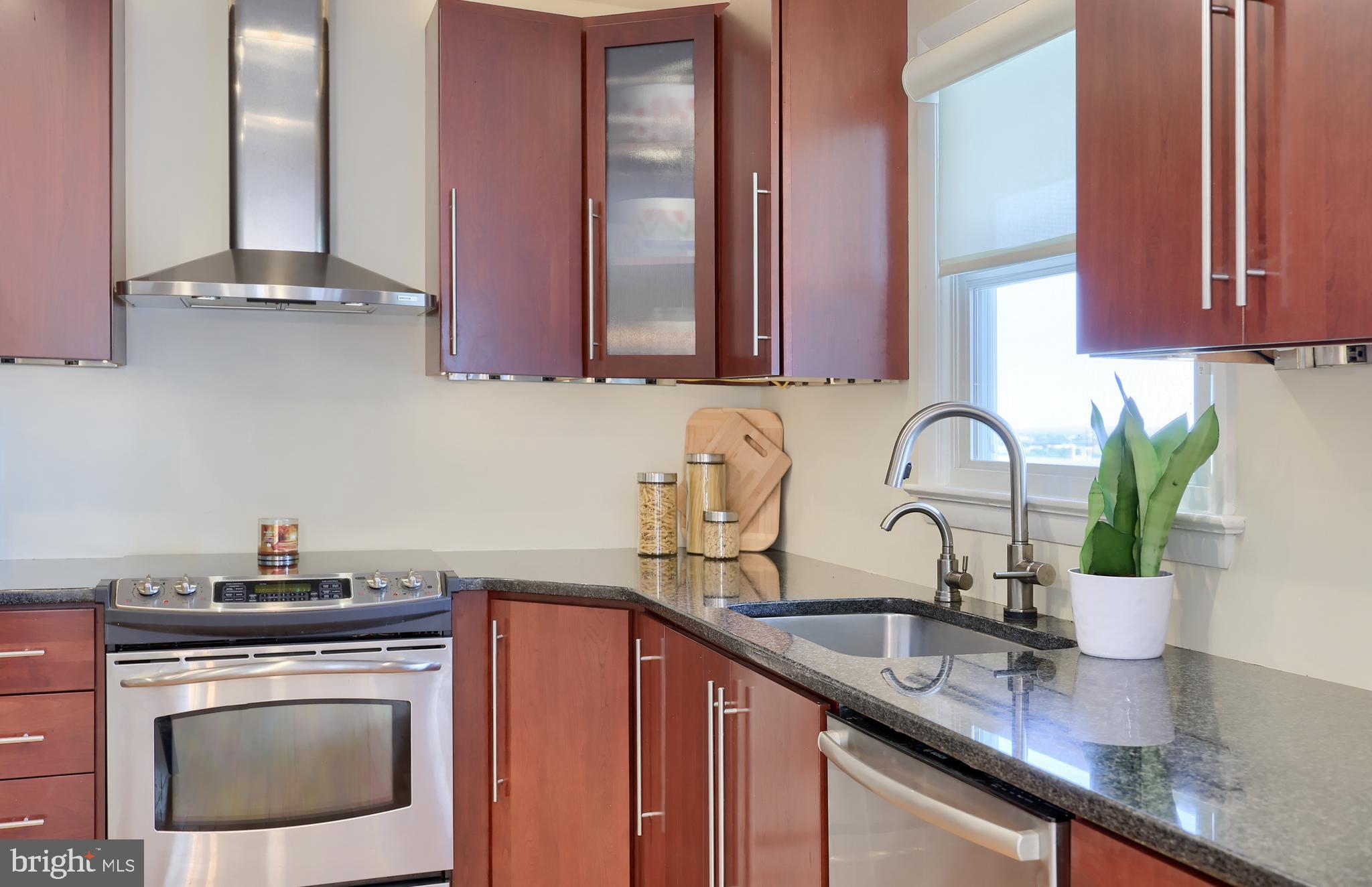 670 Shultz Road Washington Boro, PA 17582 - Photo 15 of 79 a kitchen with stainless steel appliances granite countertop a sink a stove and cabinets