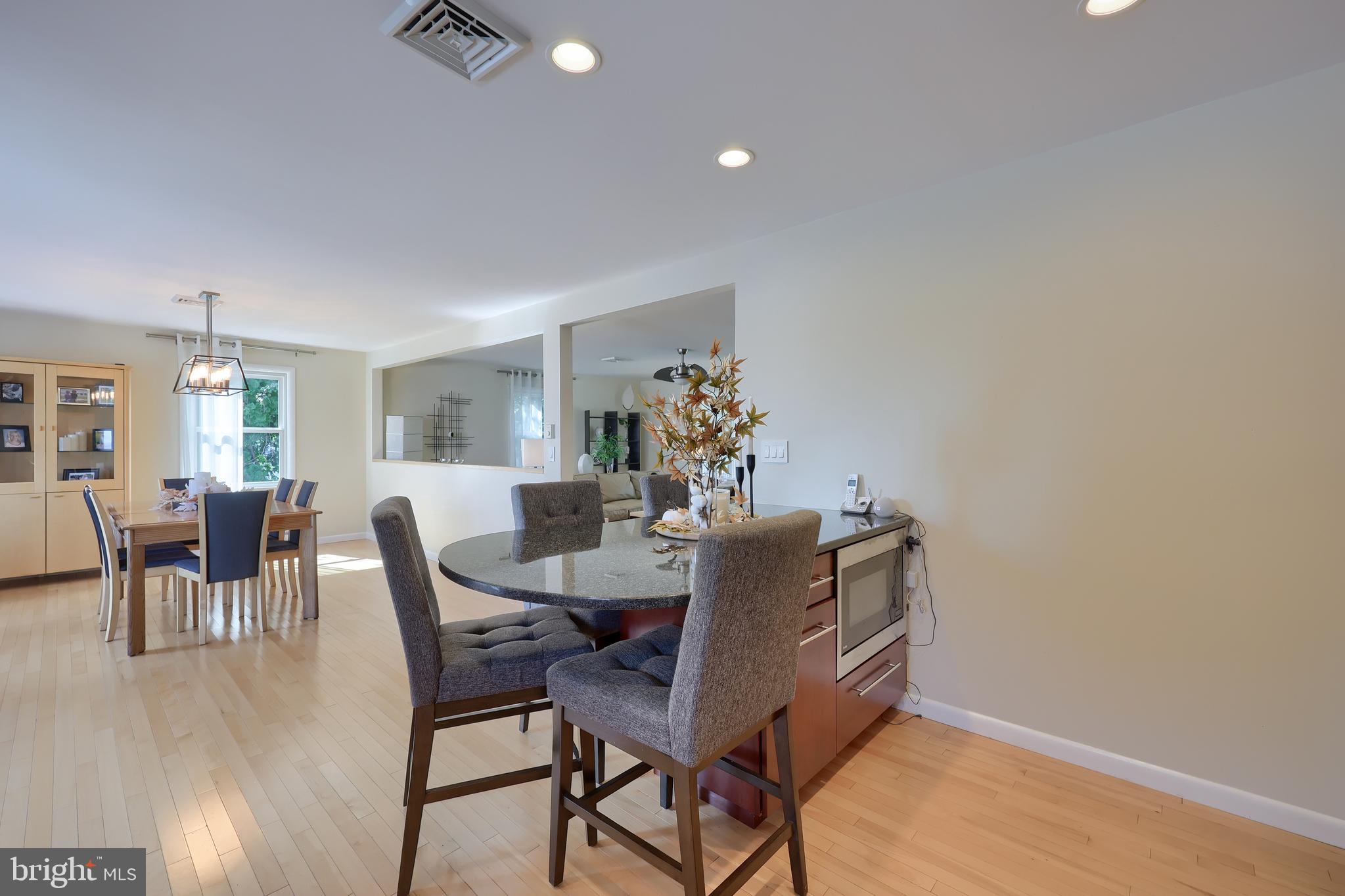 670 Shultz Road Washington Boro, PA 17582 - Photo 16 of 79 a view of a dining room with furniture and wooden floor