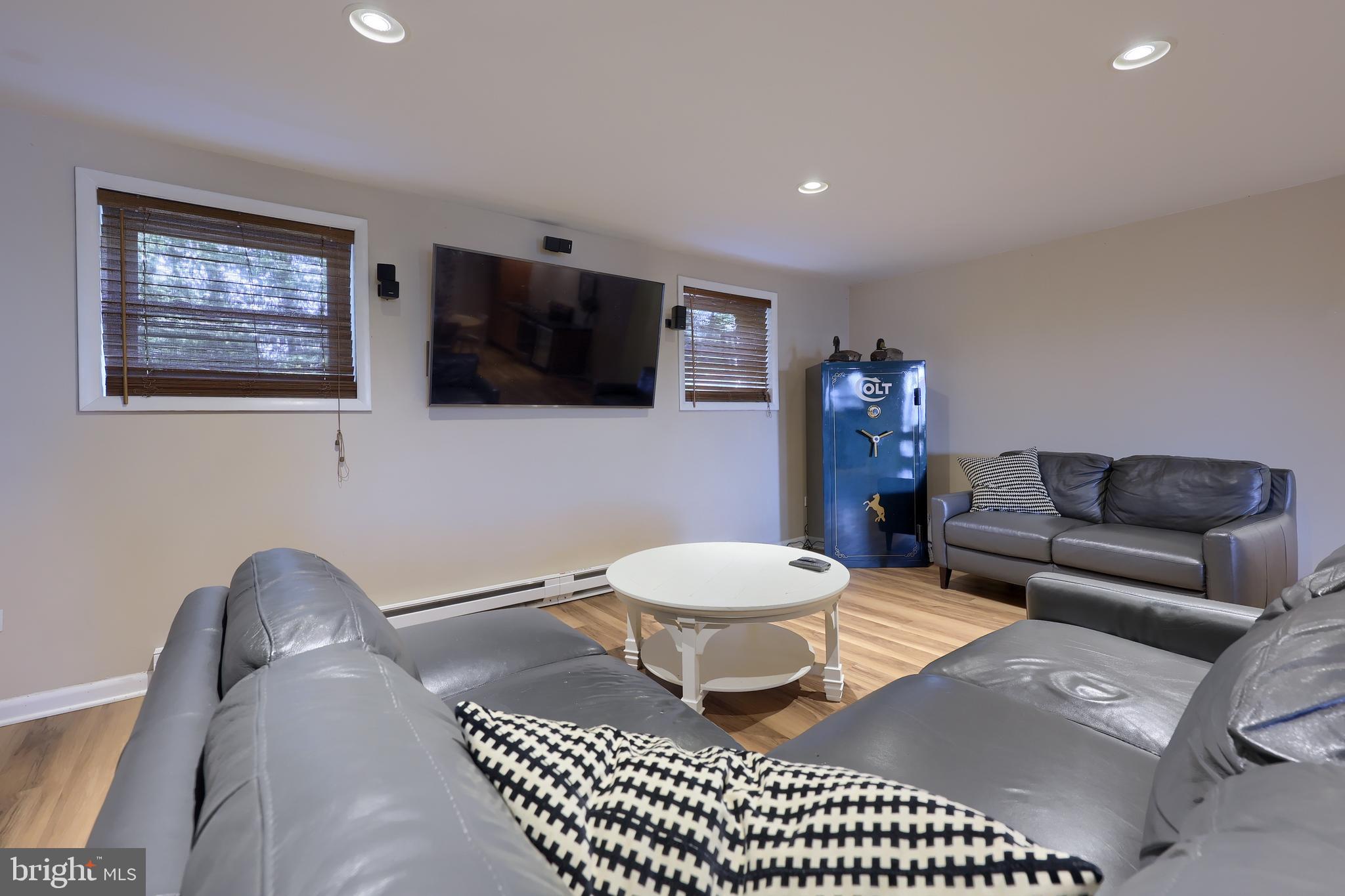 670 Shultz Road Washington Boro, PA 17582 - Photo 35 of 79 a living room with a couch a flat screen tv and a window